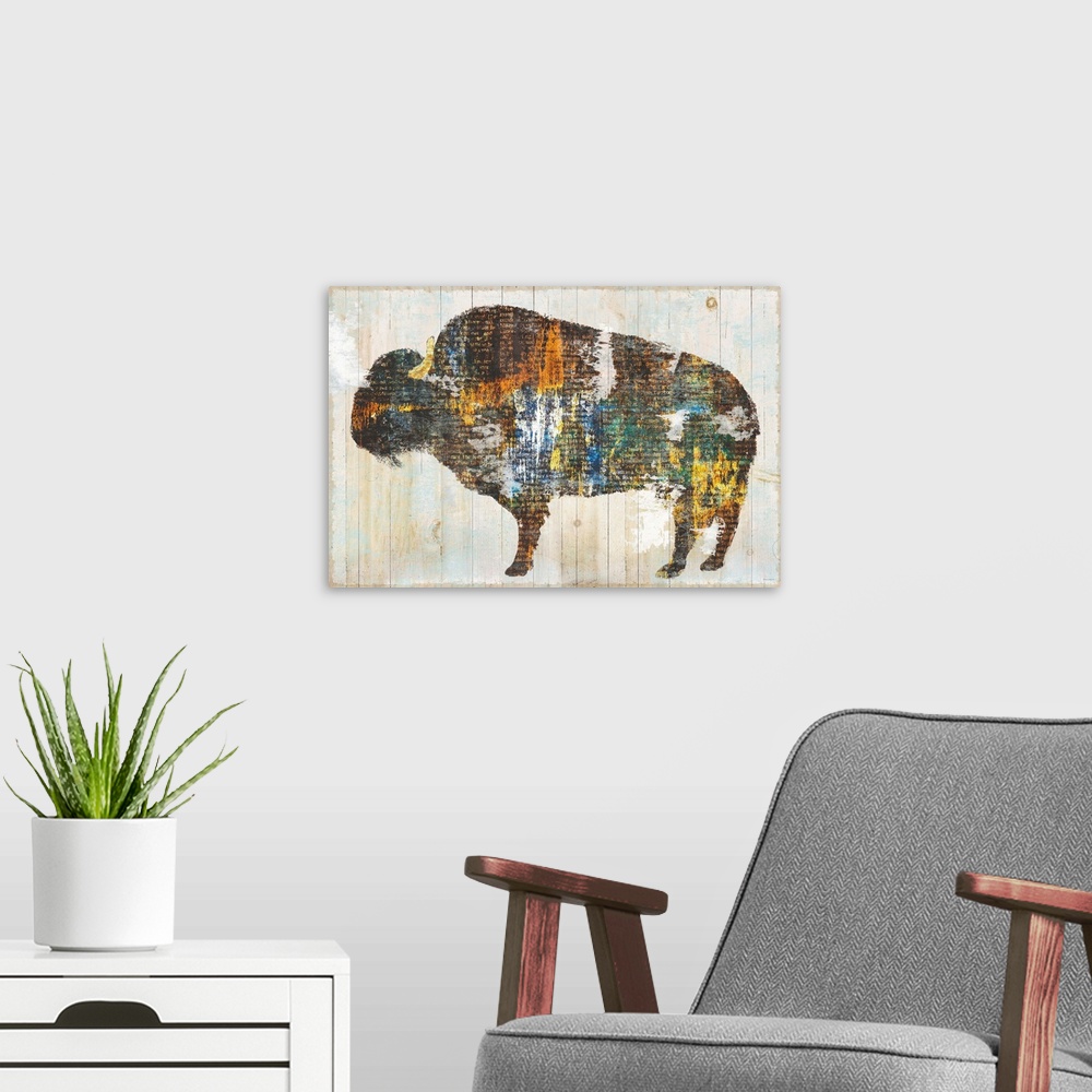 A modern room featuring Image of a bison made of multi-color textures with text peeping through, on a wood plank backdrop.