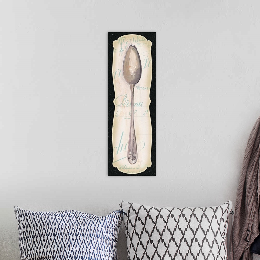 A bohemian room featuring Contemporary artwork of a silver spoon on a decorative text background, with a black border.
