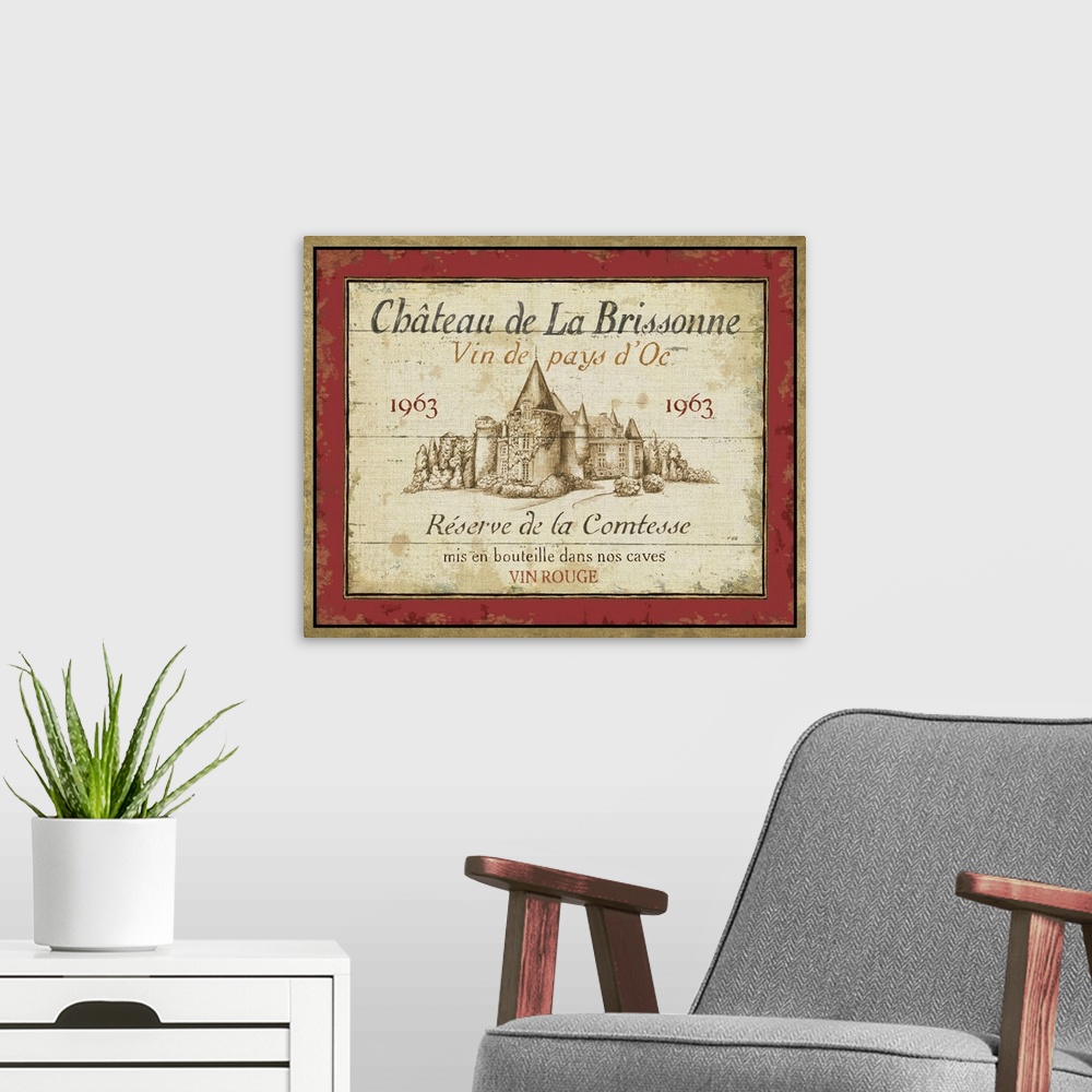 A modern room featuring Big canvas of a Chateau de la Brissonne brand French wine label featuring a castle and the year 1...