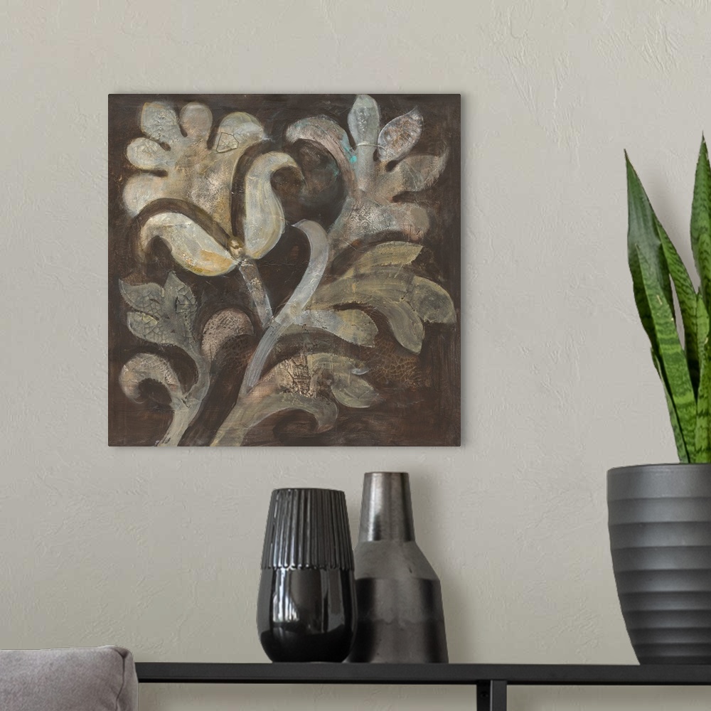 A modern room featuring Square painting of a cream colored flower with beige leaves on a brown background with a tiny hin...
