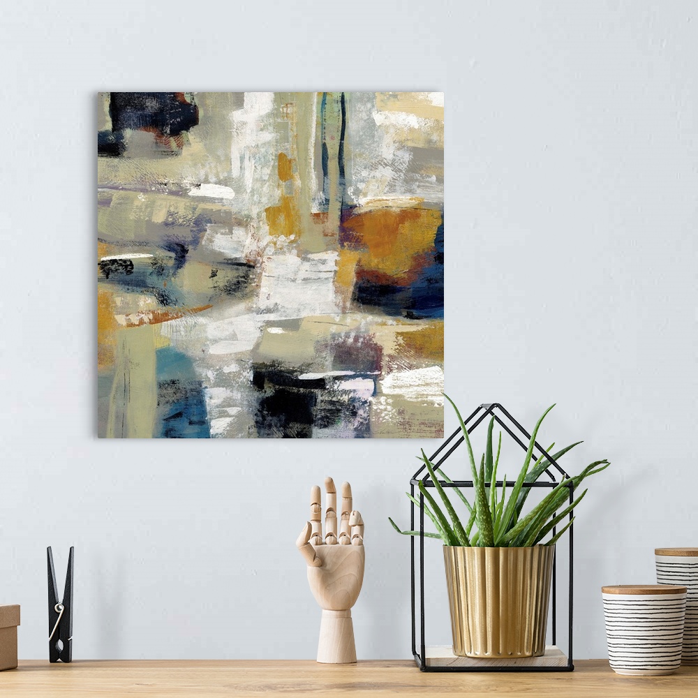 A bohemian room featuring Square abstract painting with bold colors and brushstrokes.