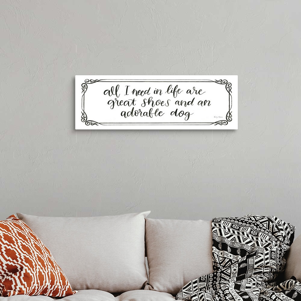 A bohemian room featuring Humorous artwork featuring the words, 'All I need in life are great shoes and an adorable dog'.
