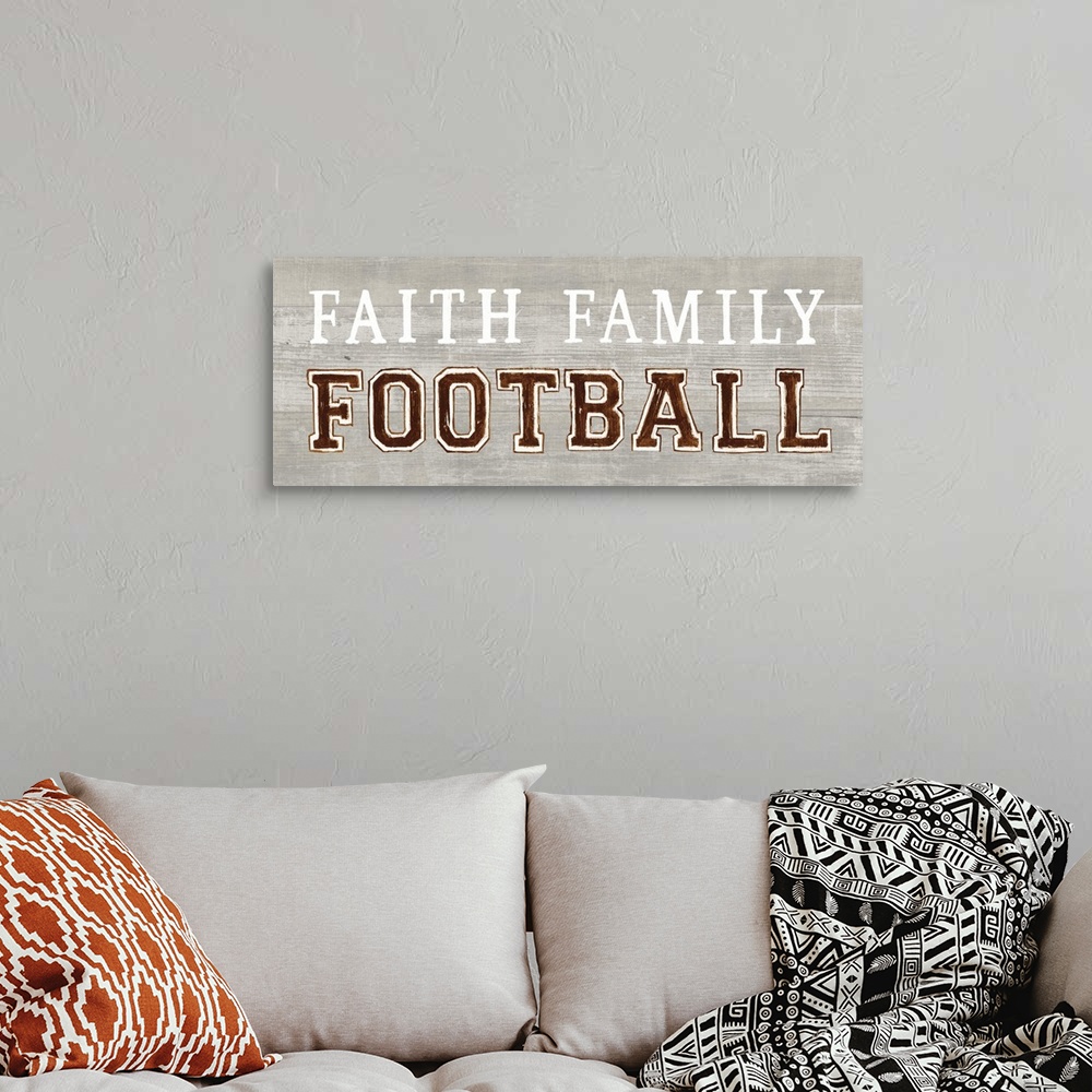 A bohemian room featuring Decorative artwork featuring the words, 'Faith, Family, Football'.