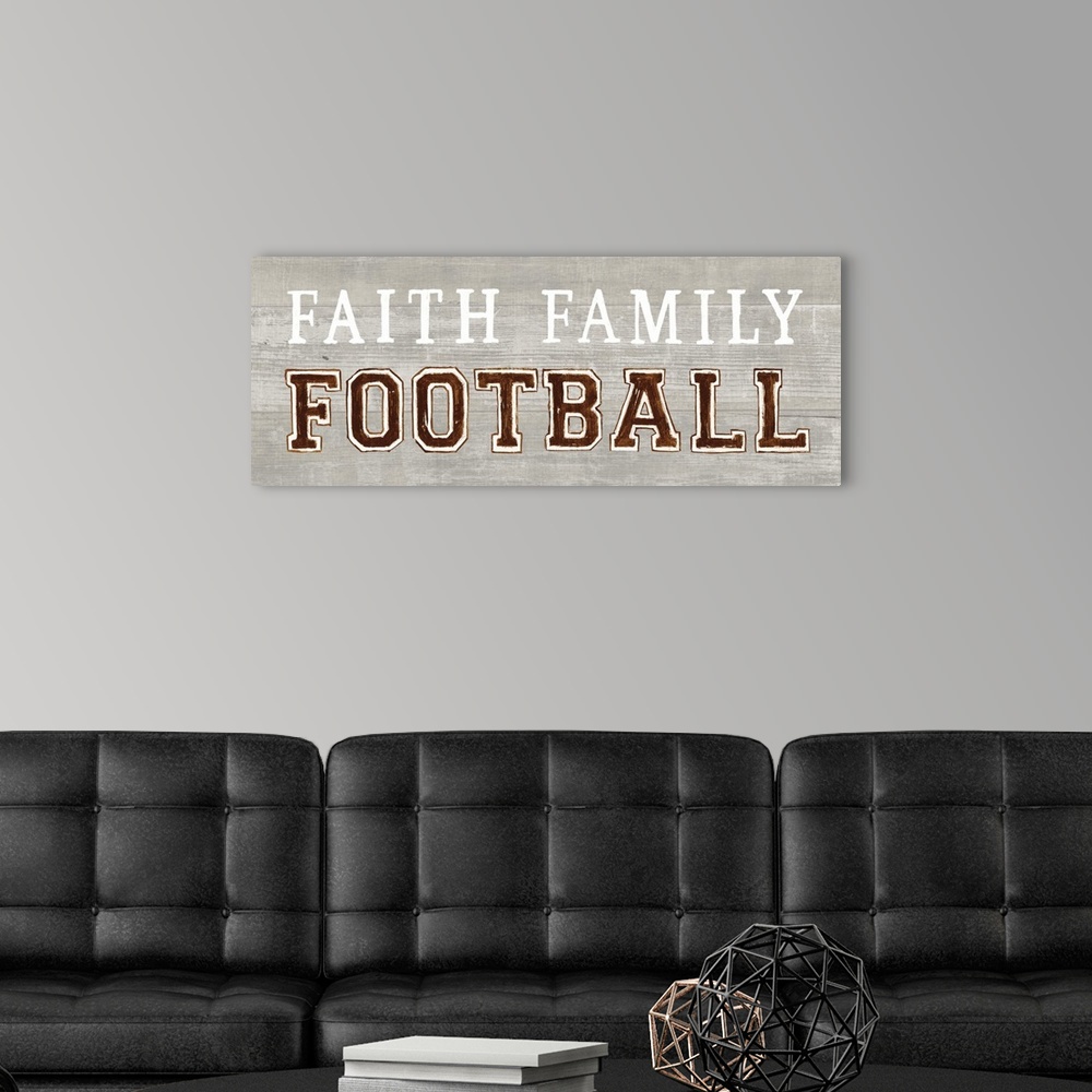 A modern room featuring Decorative artwork featuring the words, 'Faith, Family, Football'.