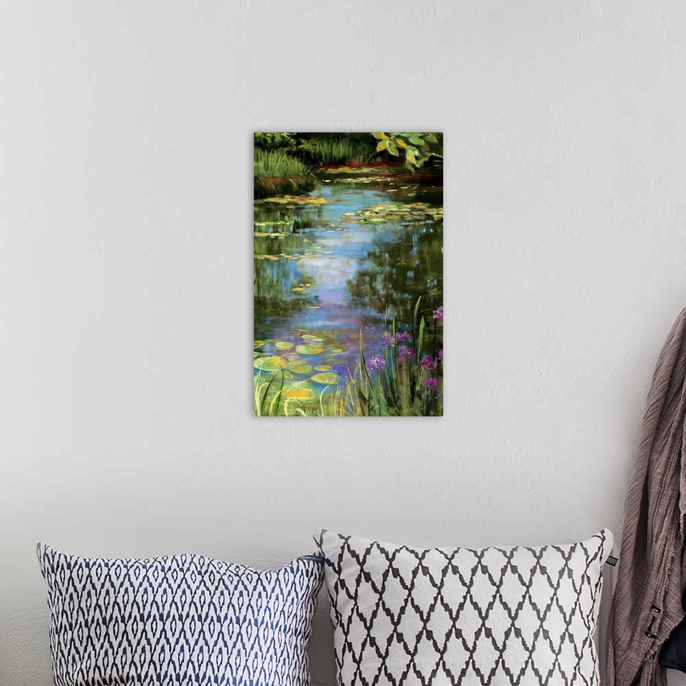 A bohemian room featuring Big vertical painting of a garden water scene with flowers, water lillies, grasses, trees and oth...