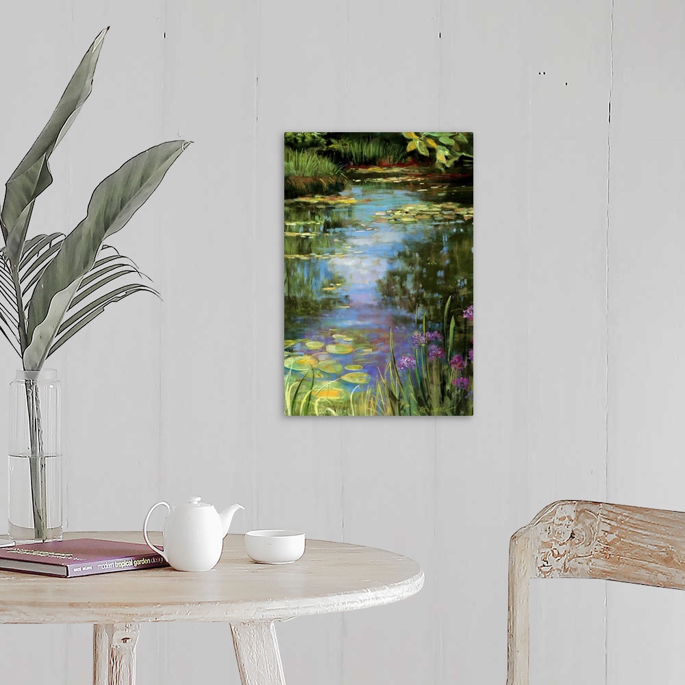 A farmhouse room featuring Big vertical painting of a garden water scene with flowers, water lillies, grasses, trees and oth...
