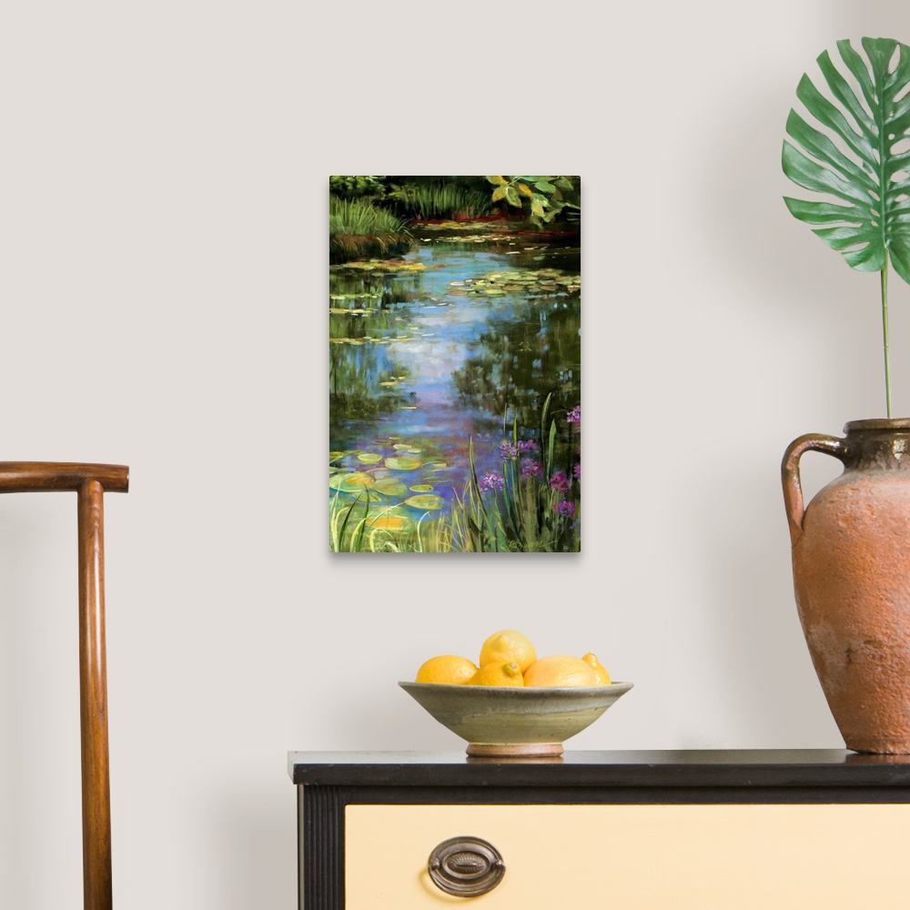 A traditional room featuring Big vertical painting of a garden water scene with flowers, water lillies, grasses, trees and oth...