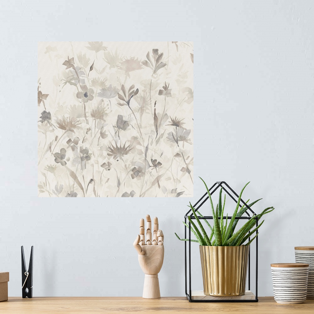 A bohemian room featuring Square abstract watercolor painting of neutral and gray toned flower silhouettes.