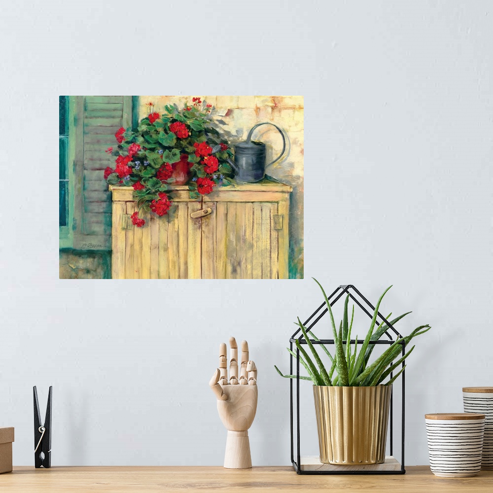 A bohemian room featuring Contemporary painting of potted flowers next to a watering can.