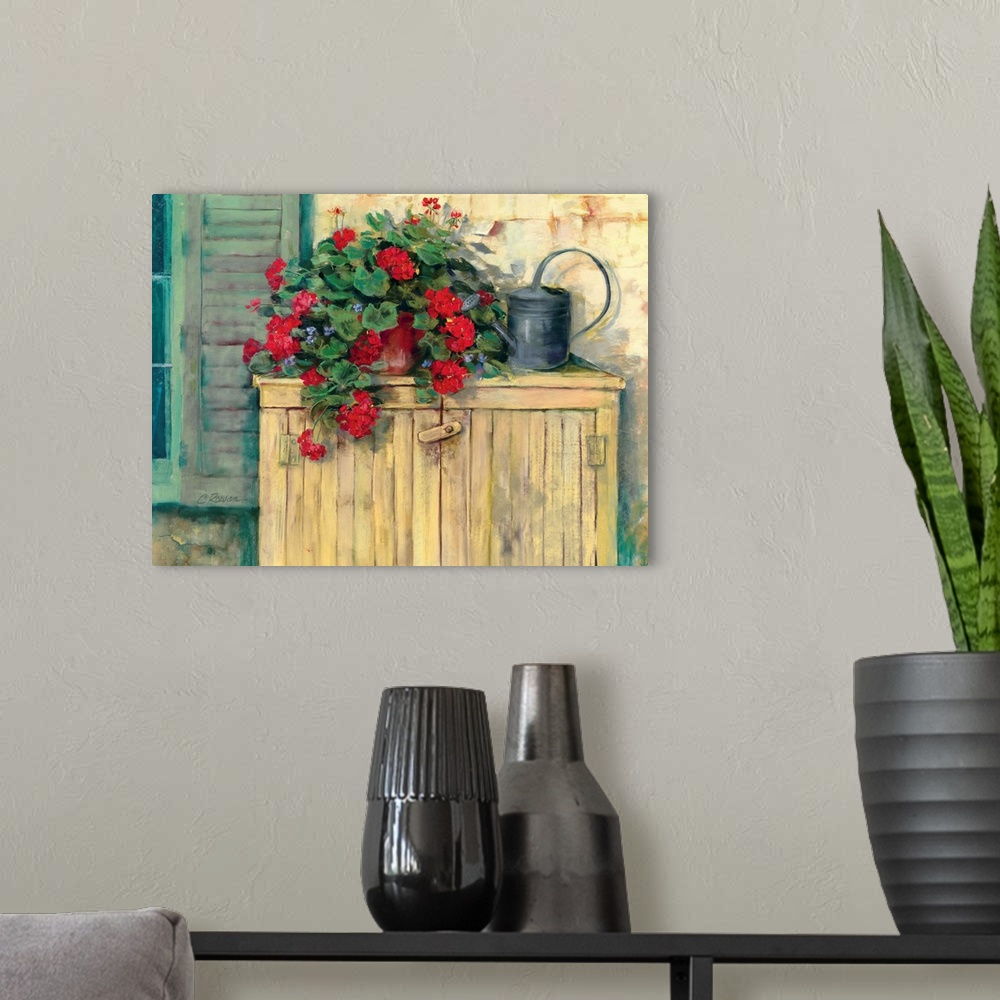 A modern room featuring Contemporary painting of potted flowers next to a watering can.
