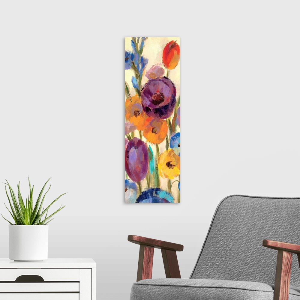 A modern room featuring Contemporary artwork of different brightly colored flowers close-up in the frame of the image.
