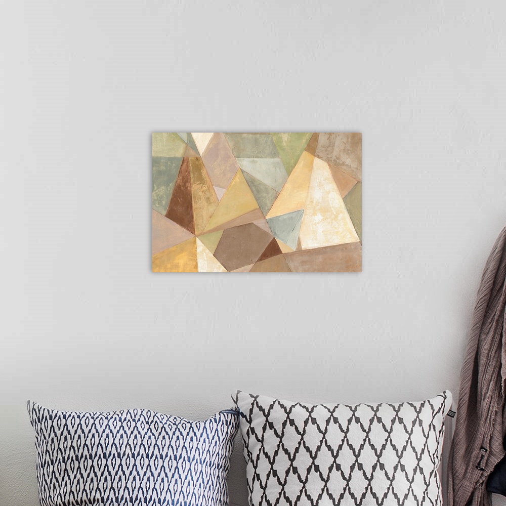 A bohemian room featuring A contemporary abstract painting of prismatic geometric shapes in neutral earthy tones.