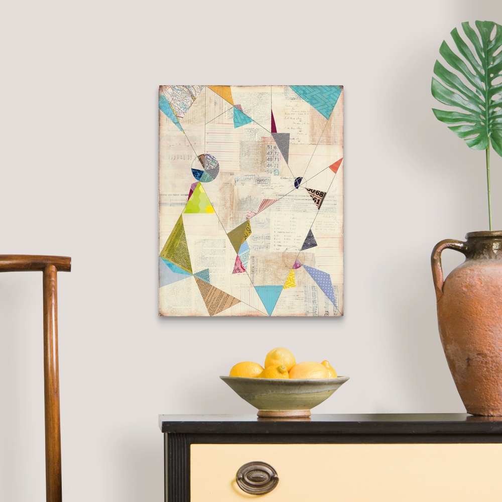 A traditional room featuring Geometric abstract artwork with colorful triangle shapes.