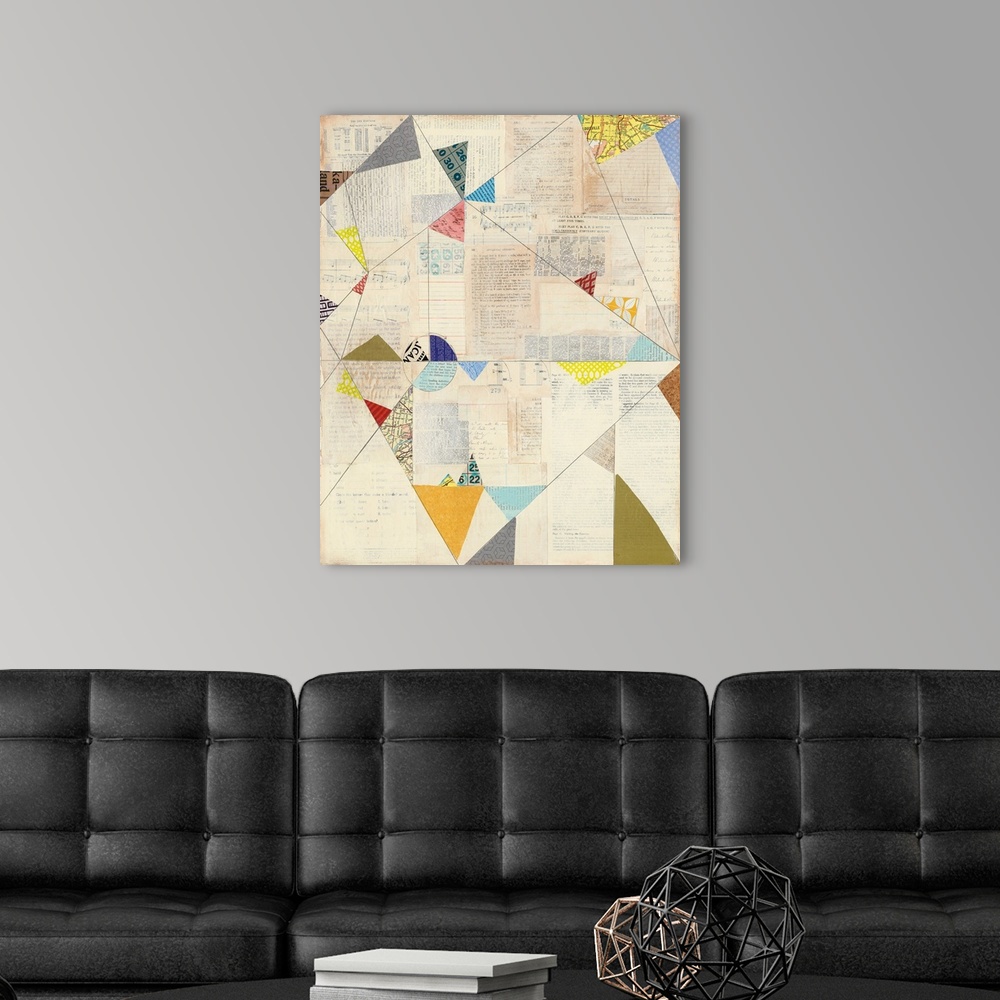 A modern room featuring Geometric abstract artwork with colorful triangle shapes.