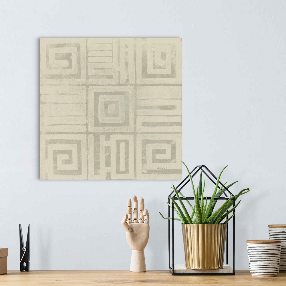 A bohemian room featuring Square abstract art created with neutral two toned colors and geometric shapes.