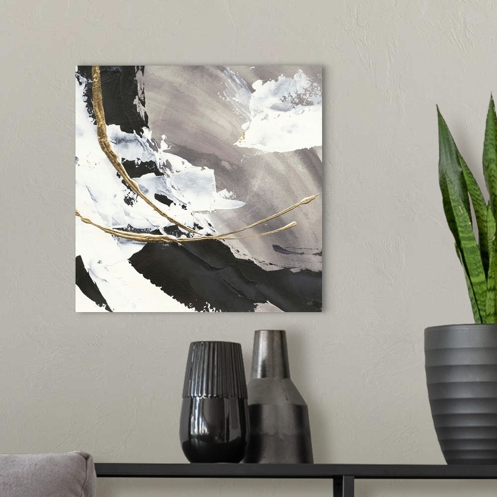 A modern room featuring Large abstract painting of various brush strokes of gray, black and white with gold line accents.