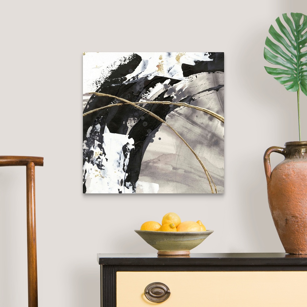 A traditional room featuring Large abstract painting of various brush strokes of gray, black and white with gold line accents.