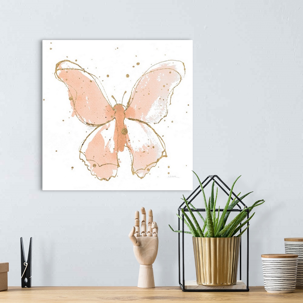 A bohemian room featuring A square watercolor painting of a peach butterfly outlined in gold with gold splatters.