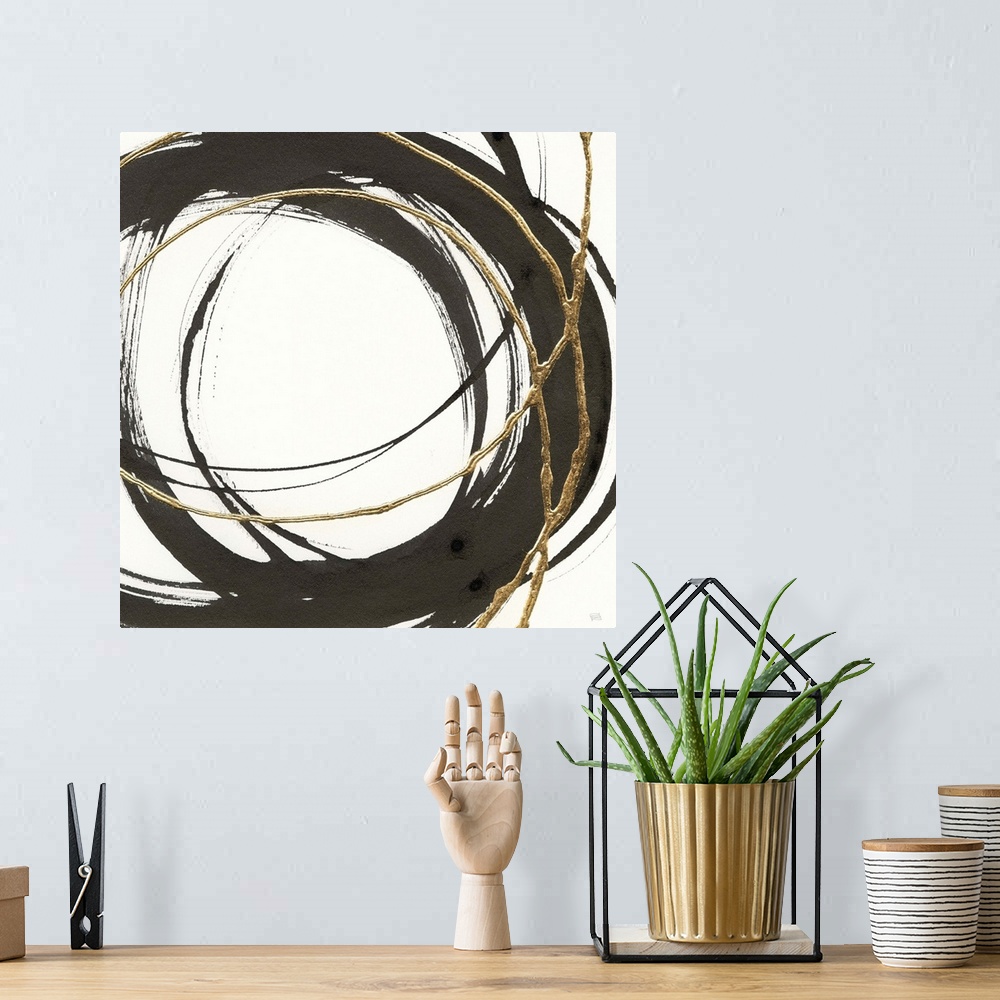 A bohemian room featuring Abstract painting with black and gold circles layered on top of each other on a white, square bac...
