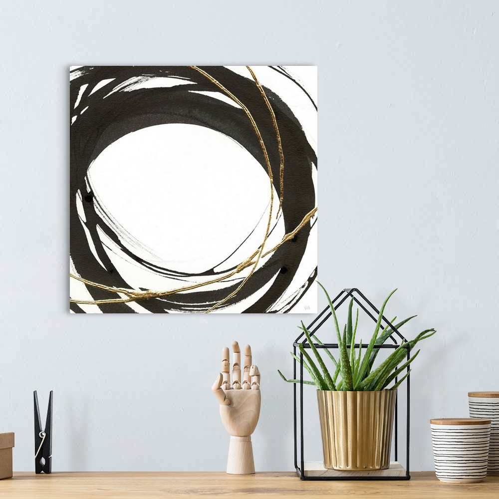 A bohemian room featuring Abstract painting with black and gold circles layered on top of each other on a white, square bac...