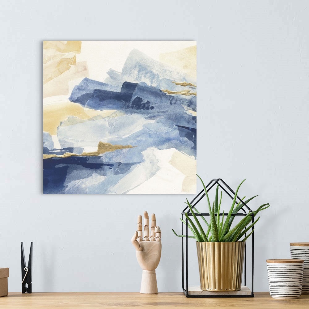 A bohemian room featuring Abstract contemporary painting with broad strokes of blue and gold.