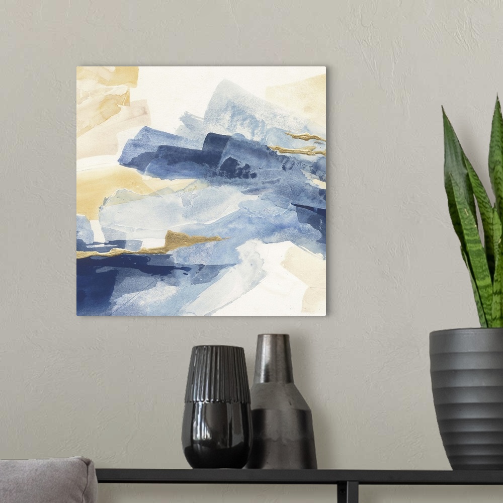 A modern room featuring Abstract contemporary painting with broad strokes of blue and gold.