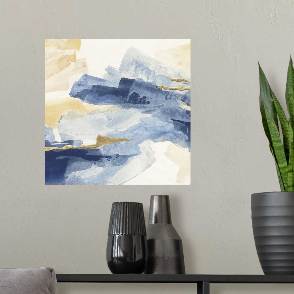 A modern room featuring Abstract contemporary painting with broad strokes of blue and gold.