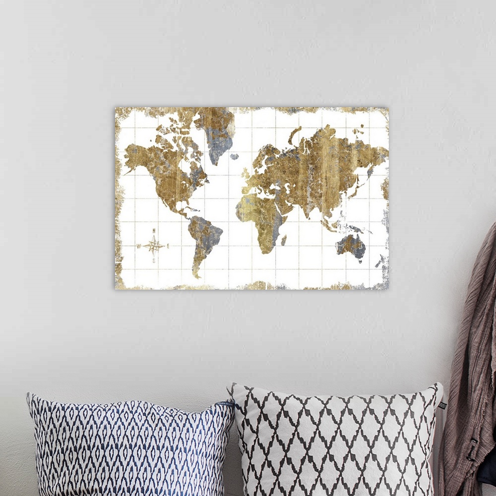 A bohemian room featuring A world map with a compass rose done in metallic tones.