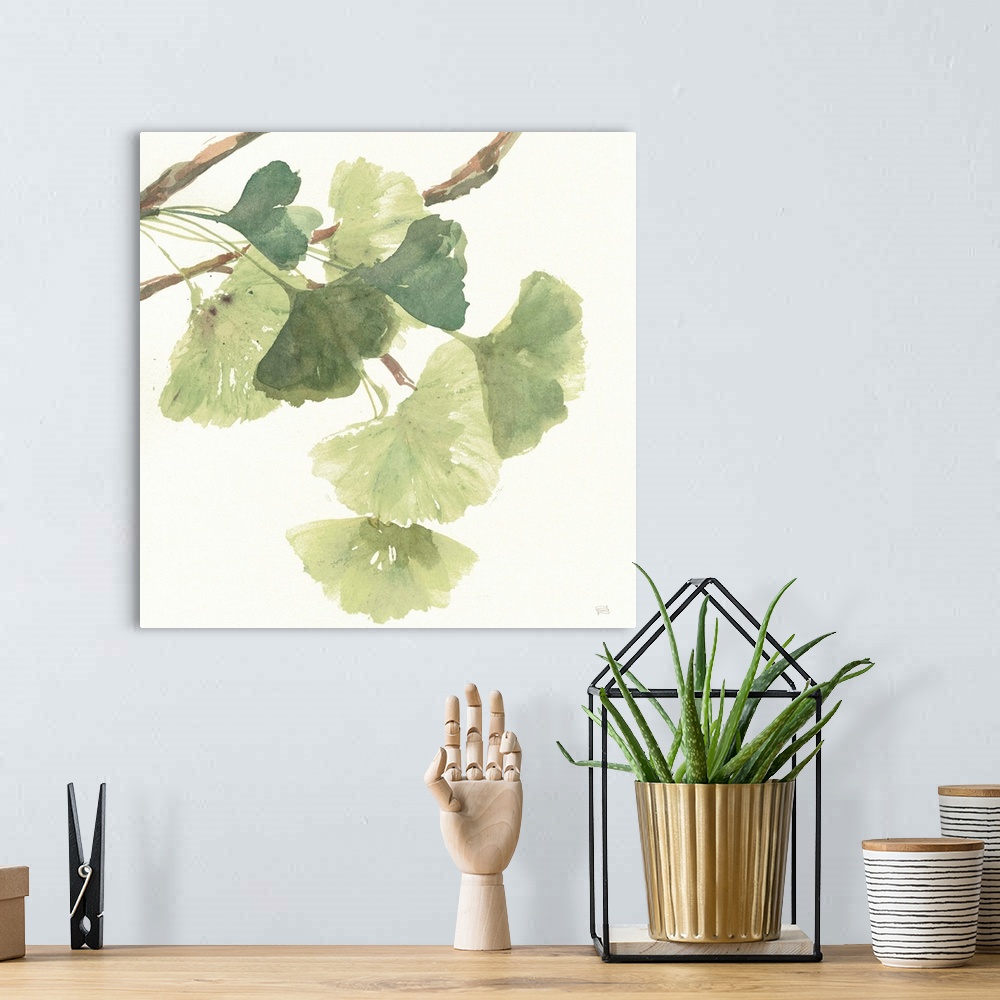 A bohemian room featuring Square watercolor painting of a branch with ginkgo leaves in shades of green on a white background.