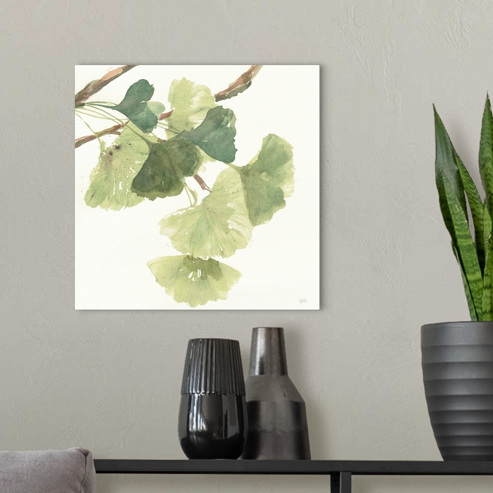 A modern room featuring Square watercolor painting of a branch with ginkgo leaves in shades of green on a white background.