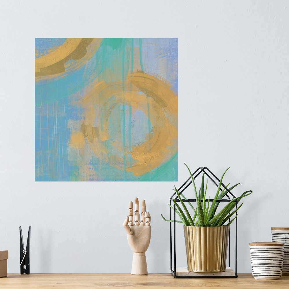 A bohemian room featuring Contemporary gold and blue abstract home decor artwork.