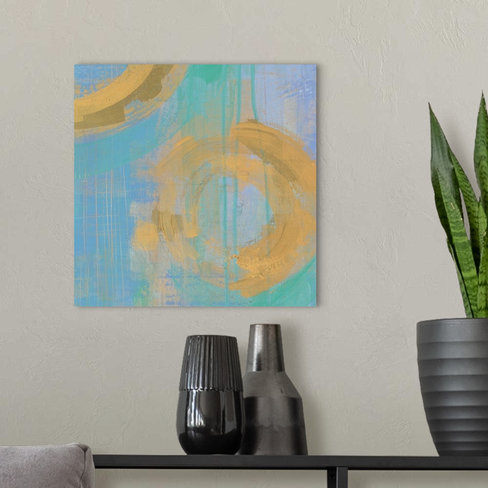 A modern room featuring Contemporary gold and blue abstract home decor artwork.