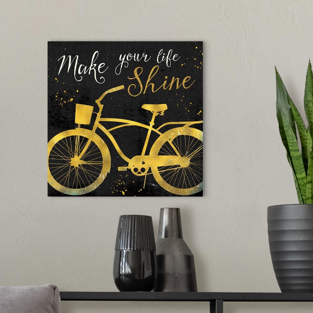 A modern room featuring Silhouette of a bicycle in gold with "Make your life shine" above it.
