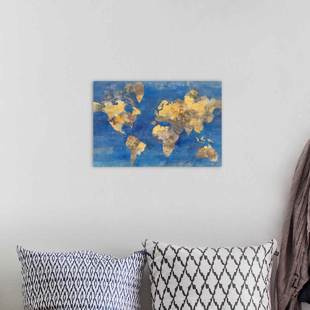 A bohemian room featuring A map of the world in golden tones with a deep blue ocean.