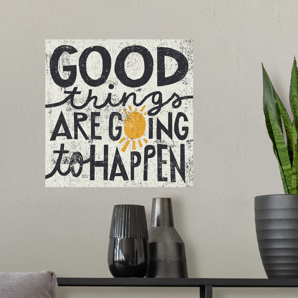 A modern room featuring Big, square canvas art of the text "good things are going to happen", the "o" in "going" has been...