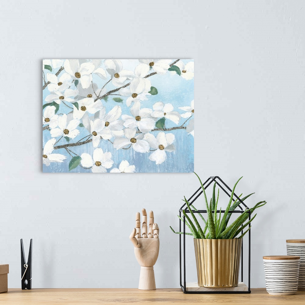 A bohemian room featuring Contemporary painting of dogwood flowers with a light blue background.