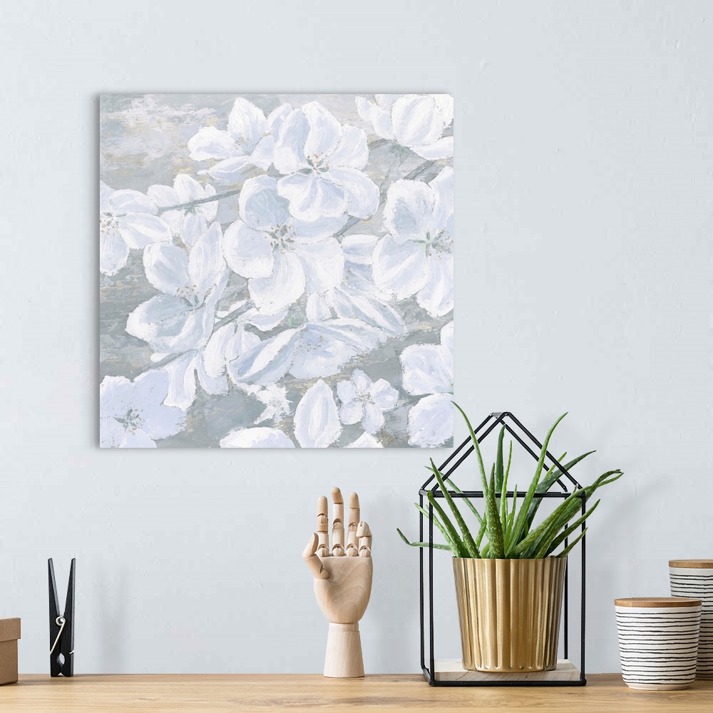 A bohemian room featuring Square painting of cool toned white flowers on a slate blue and grey background.