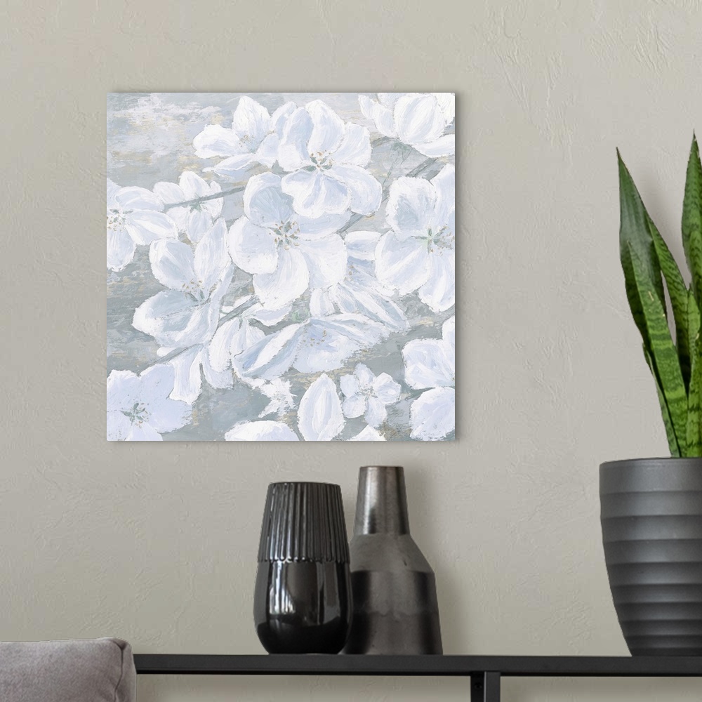 A modern room featuring Square painting of cool toned white flowers on a slate blue and grey background.