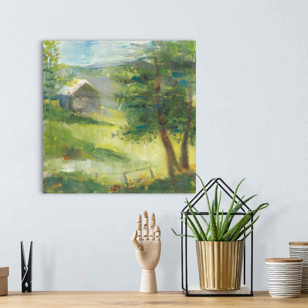A bohemian room featuring Square landscape painting of tree filled meadows in front of a gray barn with rolling hills in th...