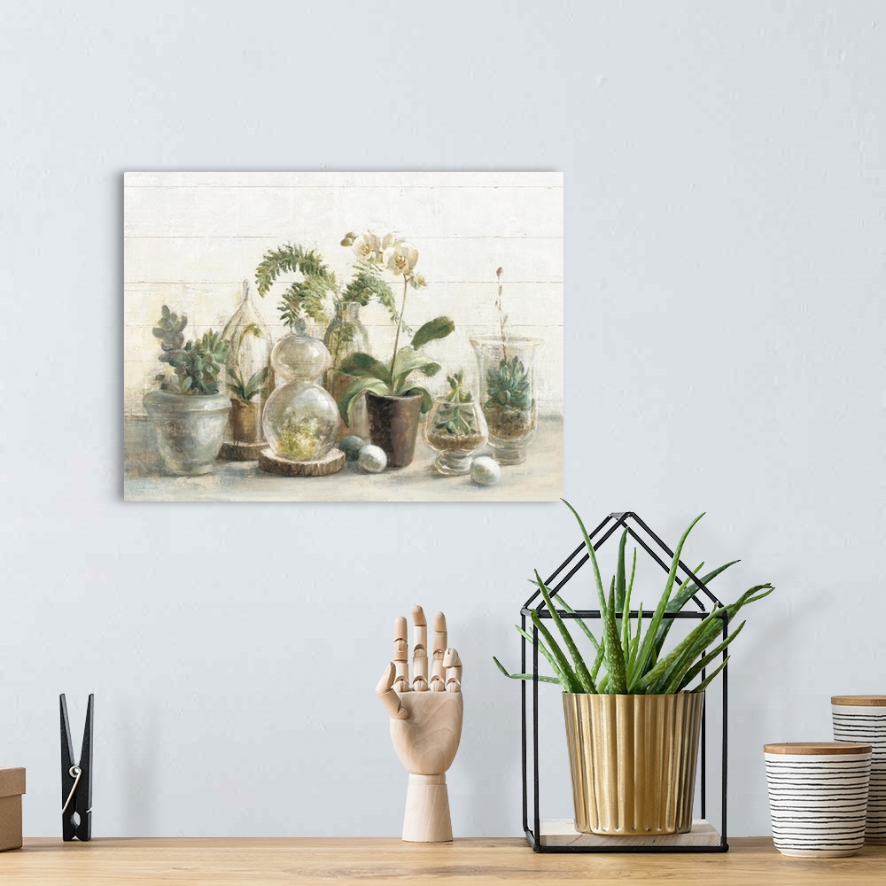A bohemian room featuring A contemporary painting of a group of glass covered succulents and orchids against a white wood w...