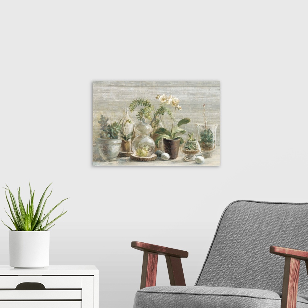 A modern room featuring Contemporary still life painting of potted orchids and small terrariums.