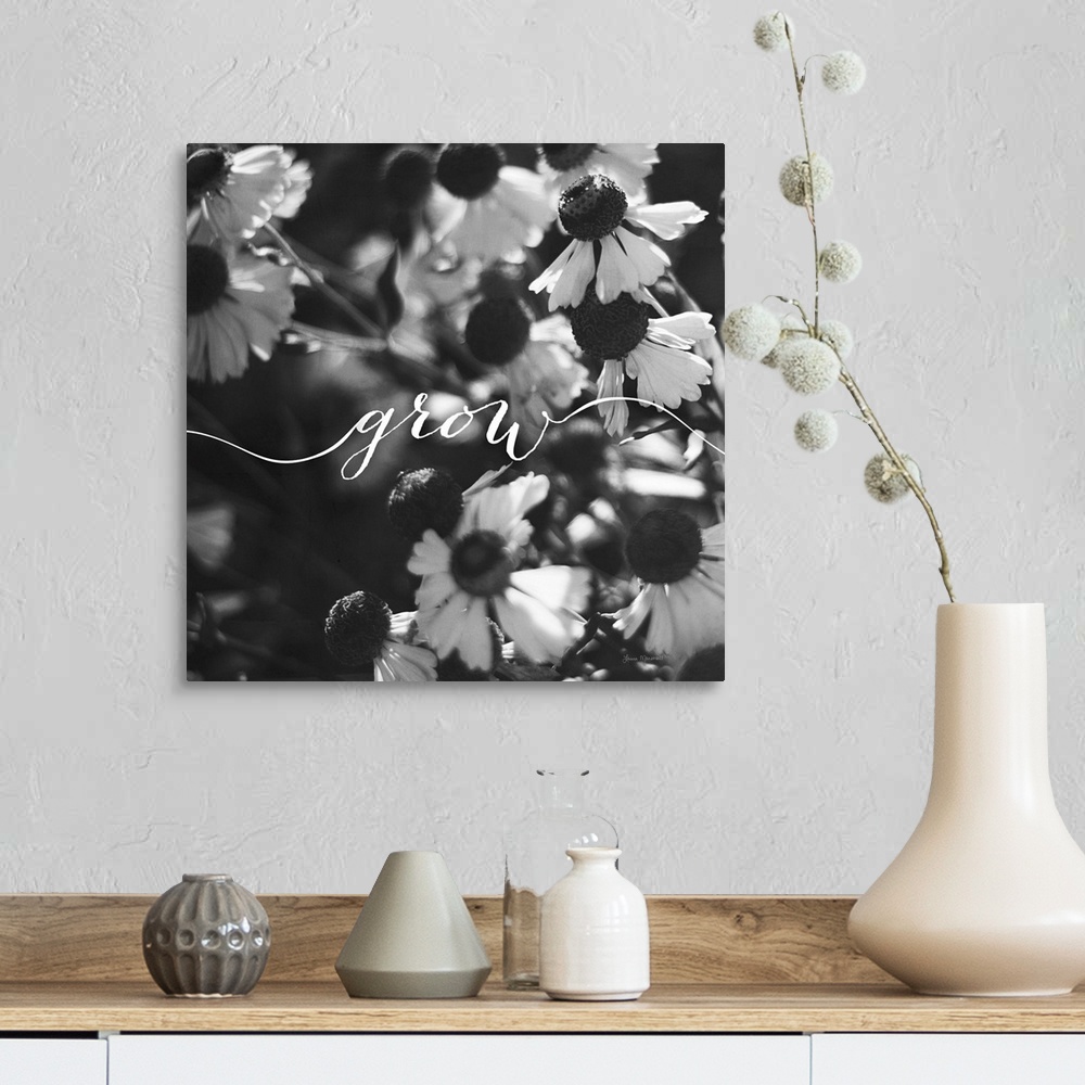 A farmhouse room featuring Handlettering in white across a black and white photograph of flowers.