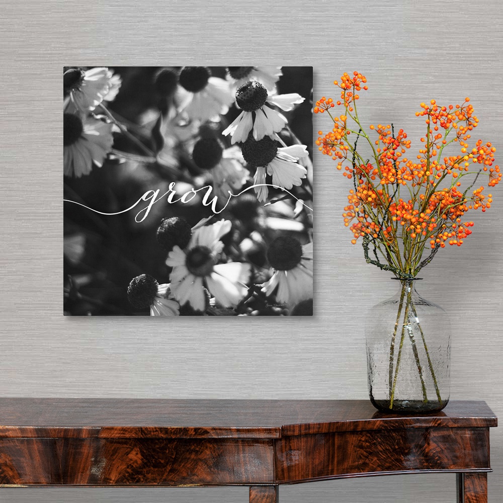 A traditional room featuring Handlettering in white across a black and white photograph of flowers.
