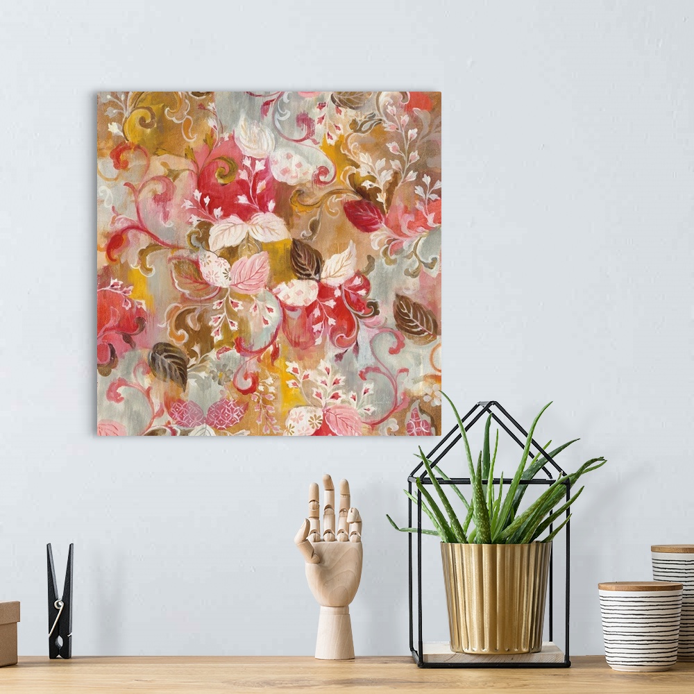 A bohemian room featuring Square painting of pink, white, and brown leaves and flowers with a red, gold, and grey background.