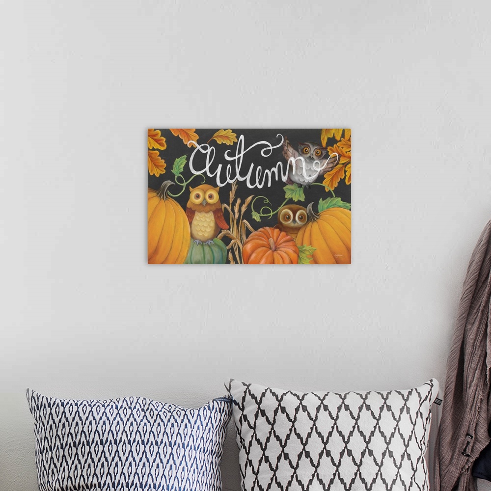 A bohemian room featuring Autumn chalkboard art of owls, pumpkins, and fall leaves with the word "Autumn" written in white ...