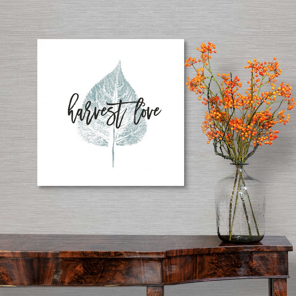 A traditional room featuring "Harvest Love" over a metallic silver leaf on white.