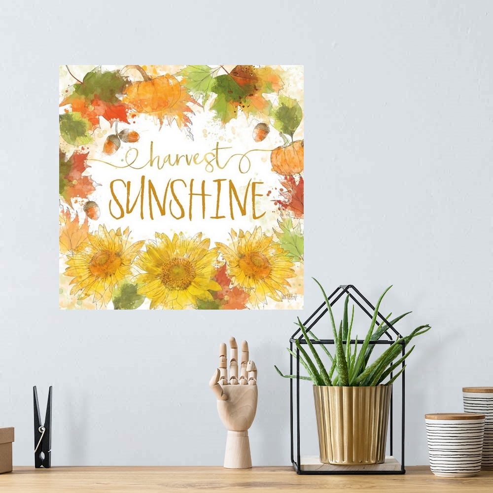 A bohemian room featuring "Harvest Sunshine" written inside a harvest wreath with Fall leaves, acorns, sunflowers, and pump...