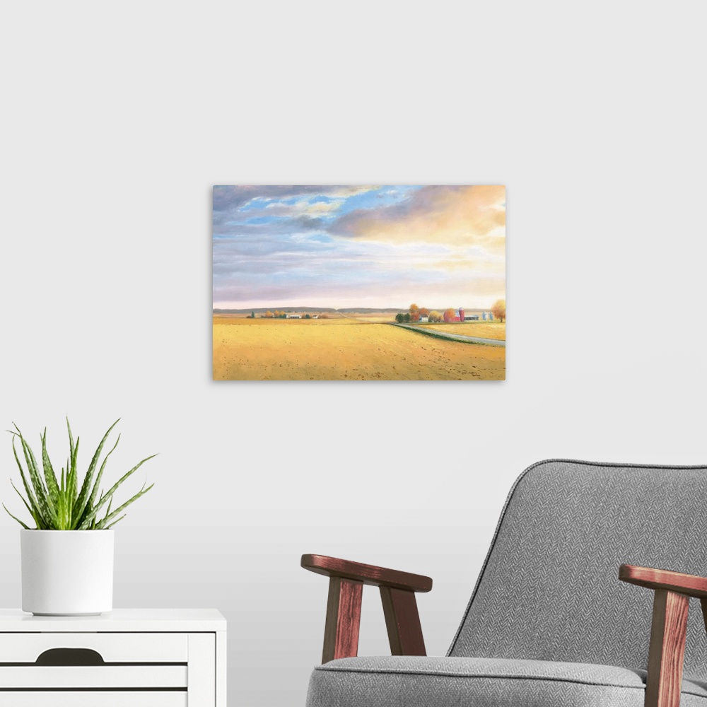 A modern room featuring Landscape painting of a rural area with golden fields and a road leading to the horizon.