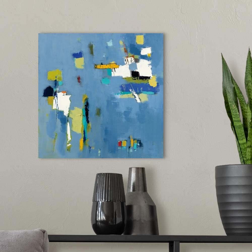 A modern room featuring Abstract artwork featuring rectangular shapes in cool colors over a light gray background.