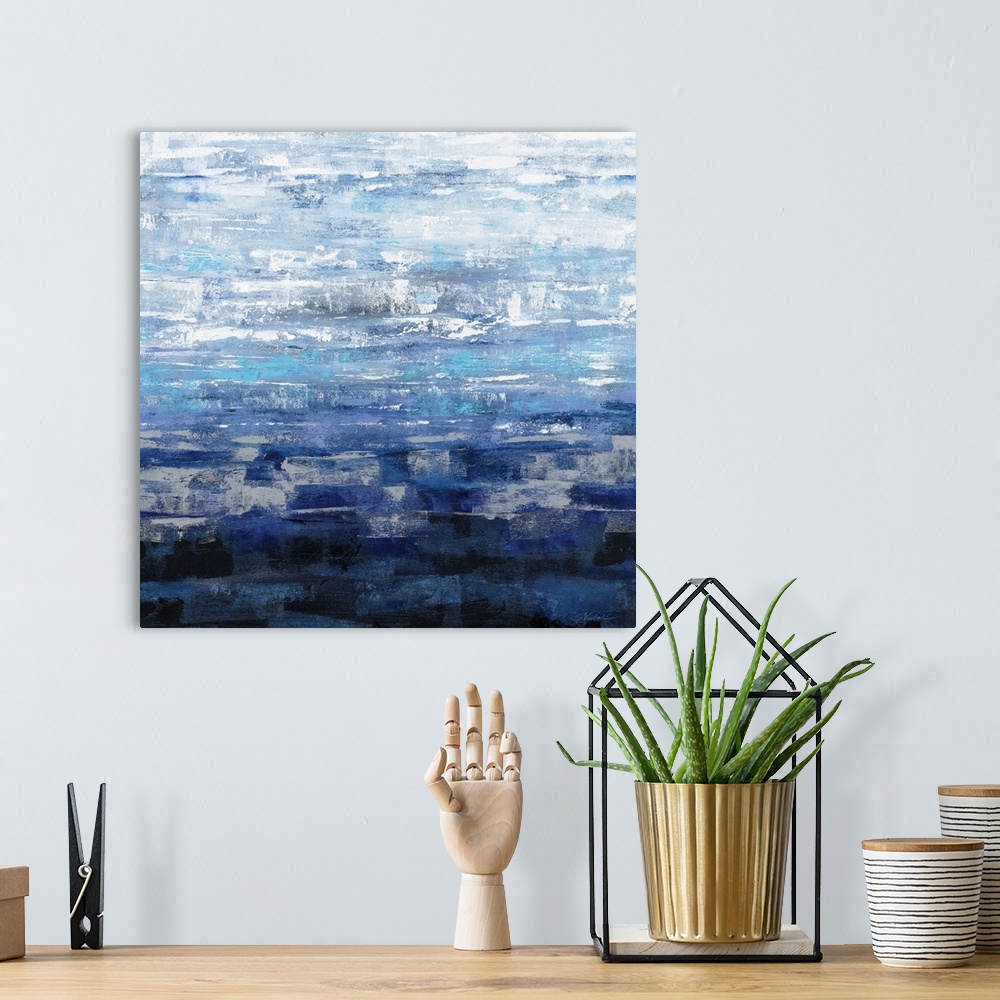 A bohemian room featuring Square abstract painting of textured brush strokes in a gradient of shades of blue.
